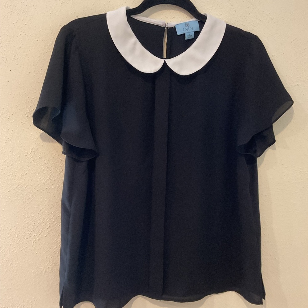 Peter Pan collar black blouse with white collar.